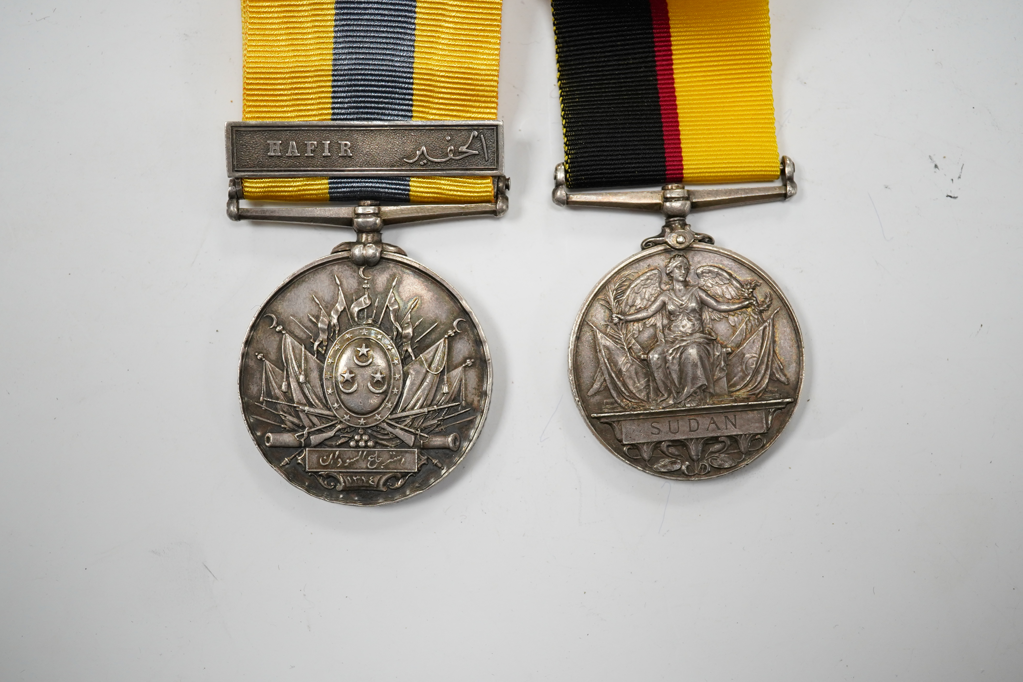 A Queen's Sudan Medal and a Khedive's Sudan (Hafir) Medal, both renamed to 4516 L Cpl W.J. Lee, Nth Stafford Rgt. Condition - fair.